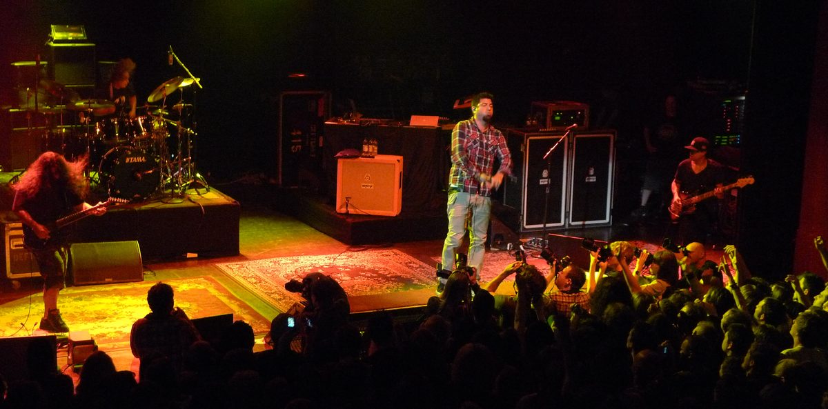 Deftones on stage at the Shepherd's Bush Empire, London, 24 August 2011: Stephen Carpenter (left), Abe Cunningham on drums, Chino Moreno and Sergio Vega on bass.