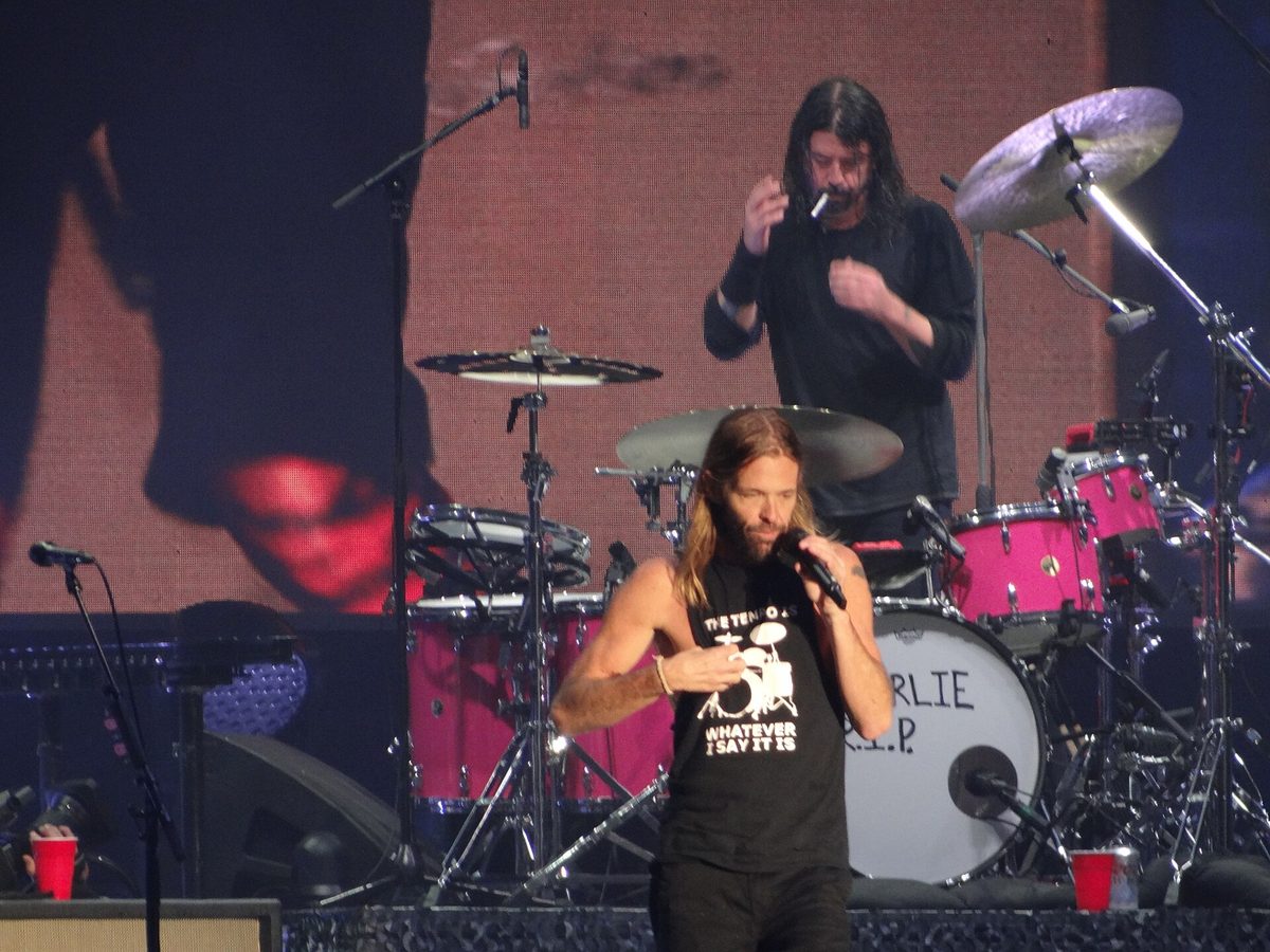 Taylor Hawkins singing at the front of the stage while Dave Grohl takes over the drums, Shaky Knees festival, Atlanta, 22 October 2021.