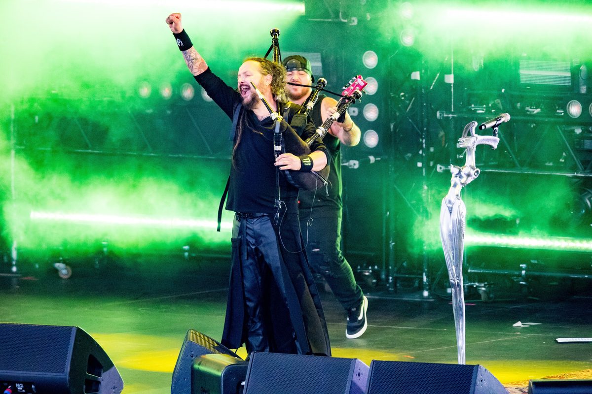 Jonathan Davis playing the bagpipes at Rock am Ring, Germany, on 5 June 2022, with touring bassist Ra Díaz behind him.