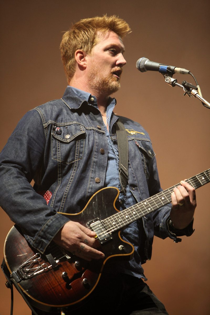 Josh Homme, Kyuss's guitarist, playing with Queens of the Stone Age at the Eurockéennes festival in Belfort, France, on 2 July 2011.