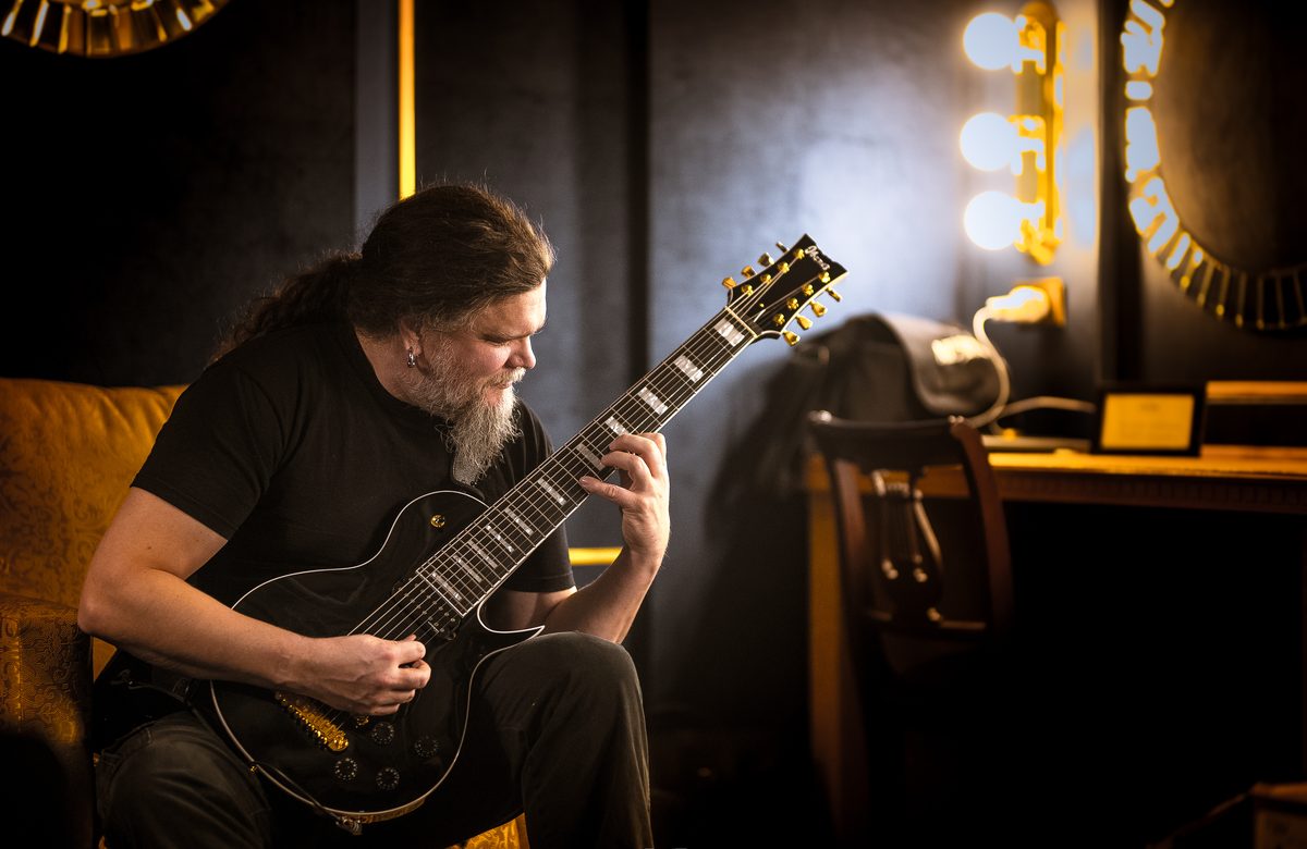Rhythm guitarist Mårten Hagström warming up backstage on an eight-string guitar, January 2018.
