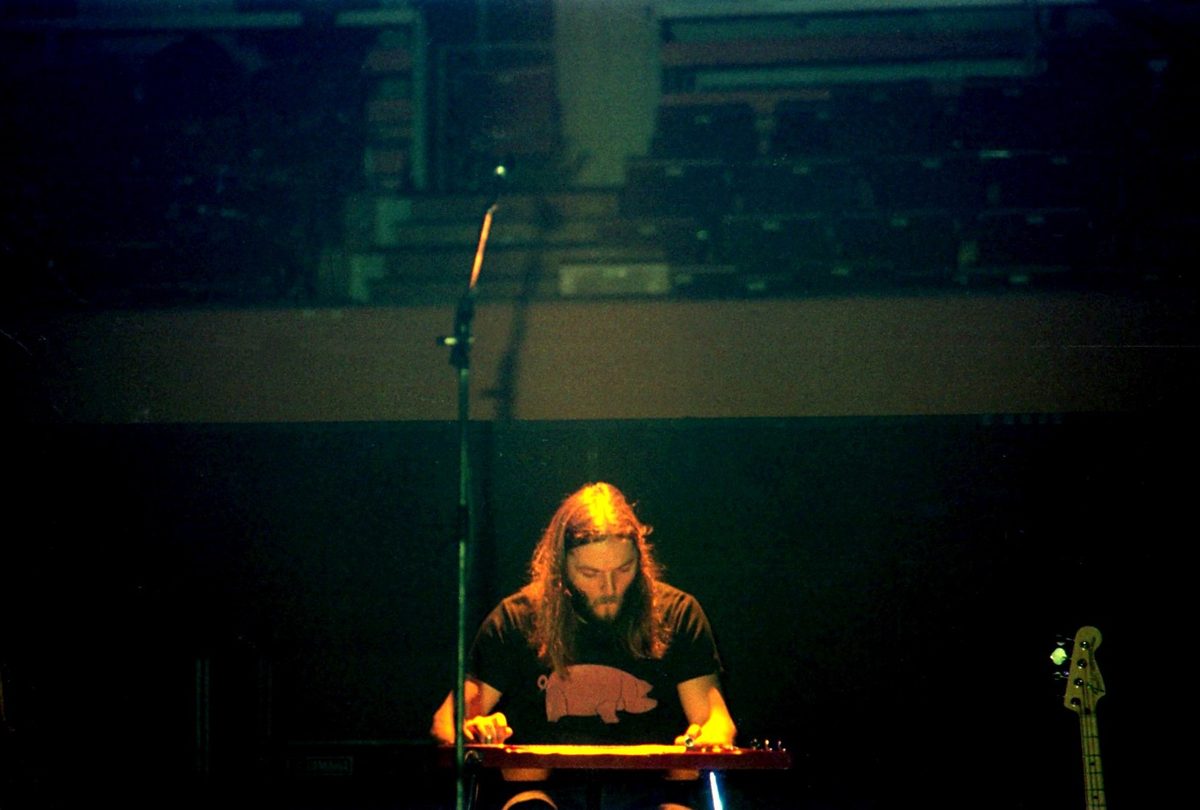 David Gilmour playing lap steel guitar with Pink Floyd at the Festhalle, Frankfurt, Germany, 26 January 1977.