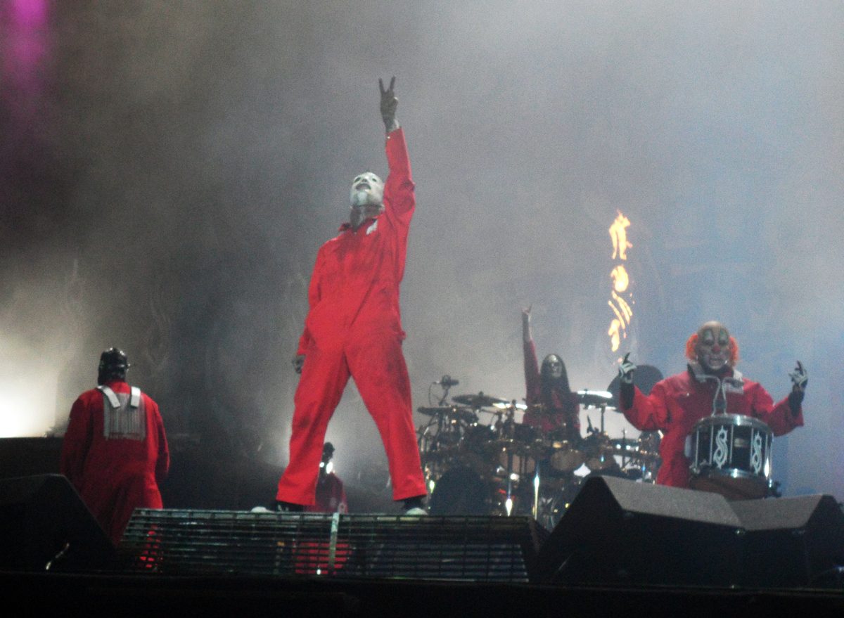 Slipknot in red jumpsuits at Graspop Metal Meeting, Dessel, Belgium, 26 June 2011, with Corey Taylor out front, Joey Jordison at the drums and Shawn Crahan on percussion.