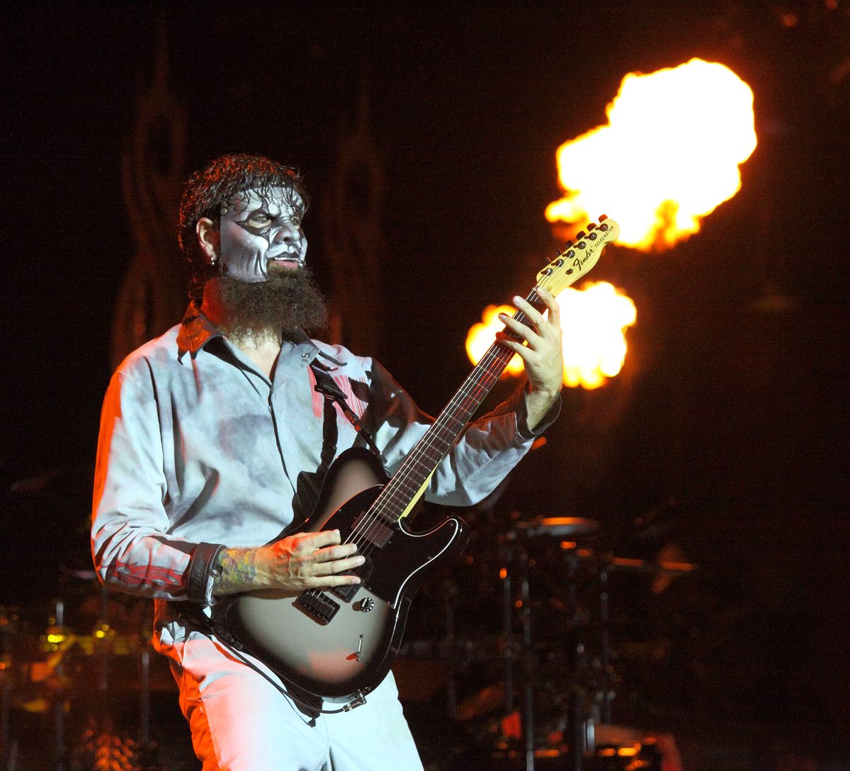 Jim Root playing his Fender Telecaster in front of a burst of flame with Slipknot at Roskilde Festival, Denmark, 4 July 2013.