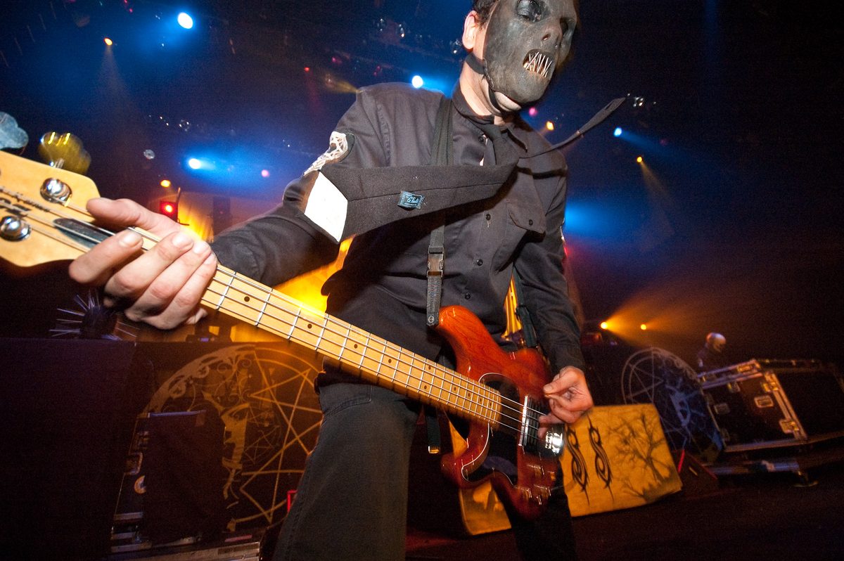 Founding bassist Paul Gray playing a four-string bass on stage with Slipknot in 2005.