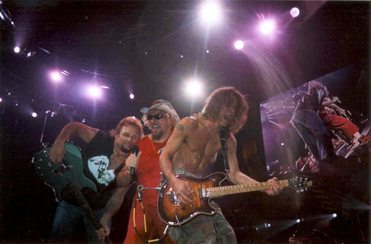 Michael Anthony, Sammy Hagar and Eddie Van Halen (left to right) on stage together during the 2004 reunion tour with Hagar.
